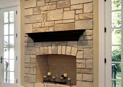 Living room in new construction home with stone fireplace